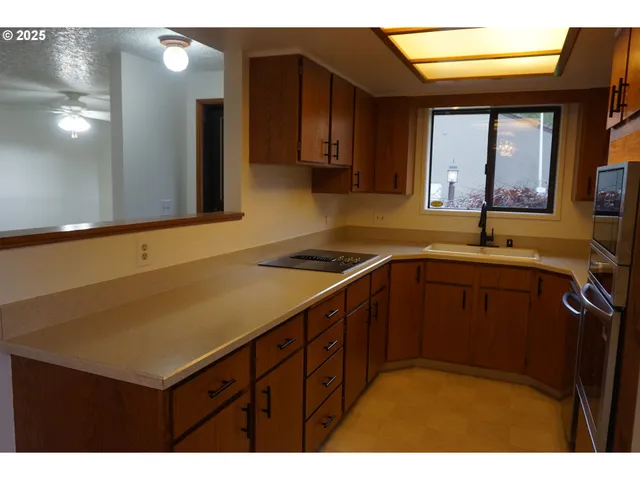 a kitchen with a sink and cabinets