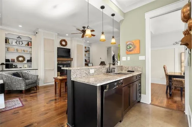 a kitchen with stainless steel appliances wooden cabinets and a counter top space
