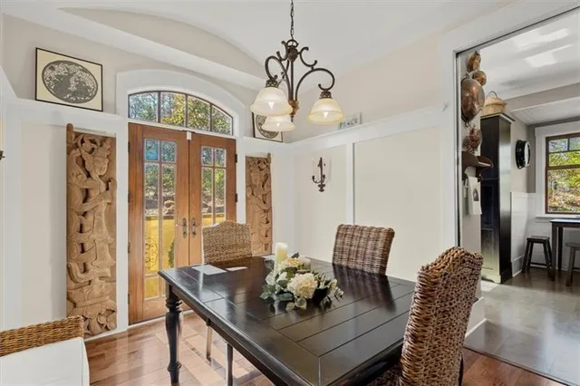 a bathroom with a granite countertop shower a mirror and a sink