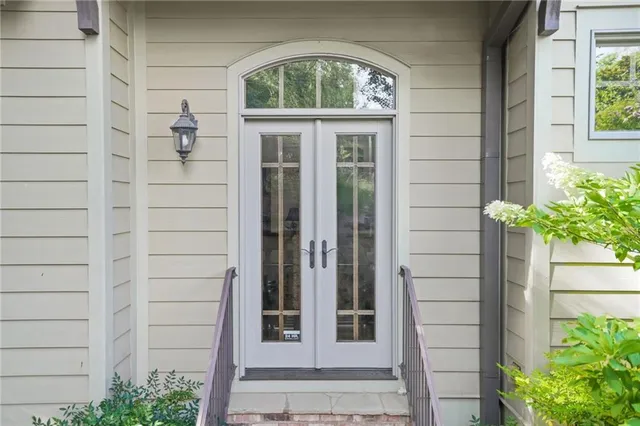 a bedroom with a bed dresser and a window