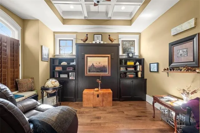 a bedroom with furniture and a rug