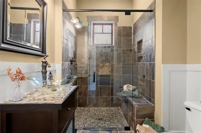 a bathroom with a sink and a mirror