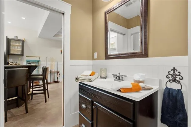 a front view of a house with a yard garage and outdoor seating