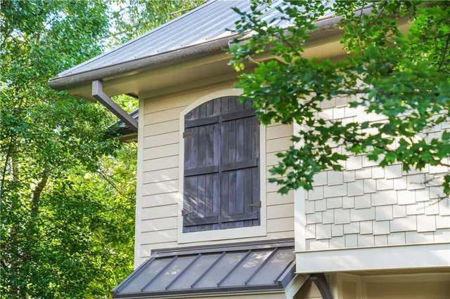 a house that has a tree in front of it