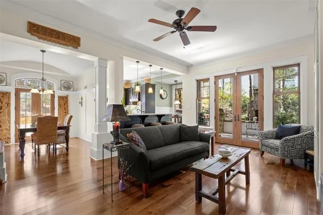 a living room with a couch and a chandelier