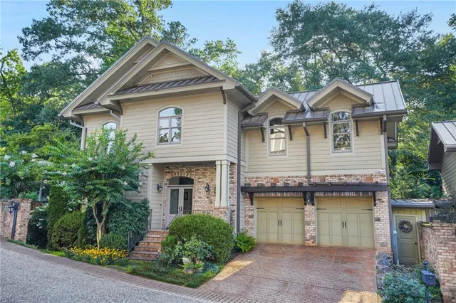 a view of a house with a flower garden