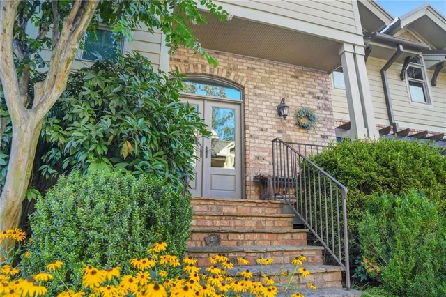 a view of a hallway with wooden floor windows and livingroom view