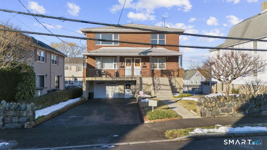 16 Harold Avenue Greenwich, CT 06830 - Photo 2 of 14 a view of a building with many windows