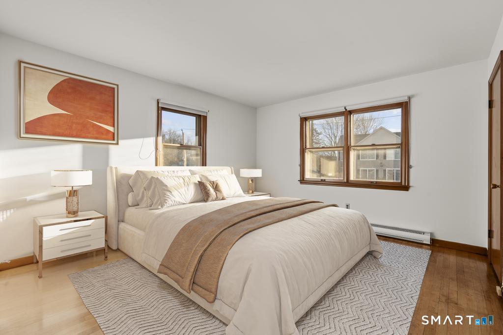 16 Harold Avenue Greenwich, CT 06830 - Photo 9 of 14 a bedroom with a bed and a window