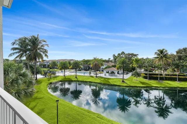 a view of a swimming pool with a yard
