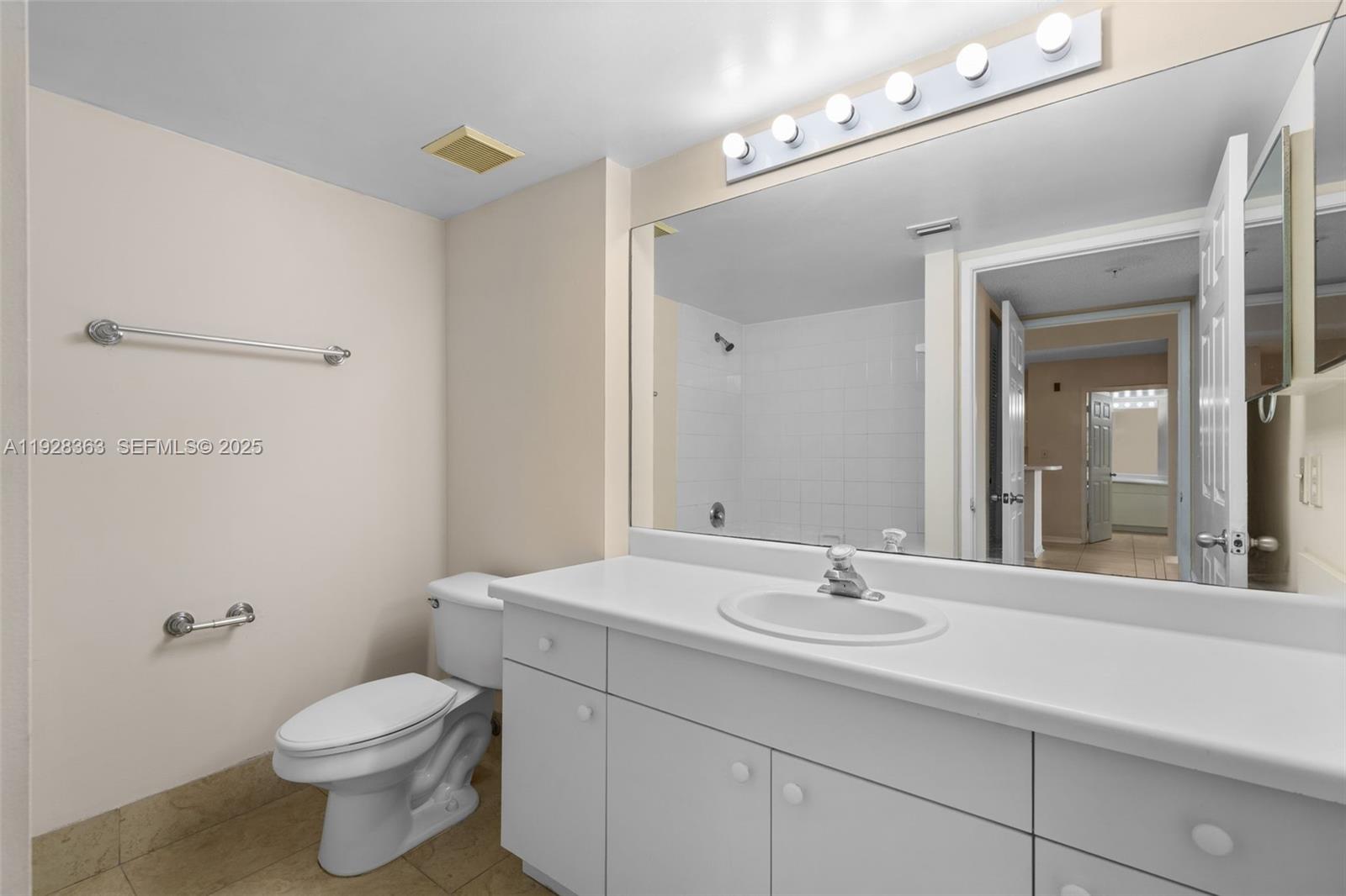 2600 South University Drive, Unit 326 Davie, FL 33328 - Photo 12 of 22 a bathroom with a sink a toilet and shower