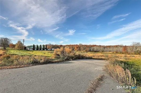 a view of a lake with sunset
