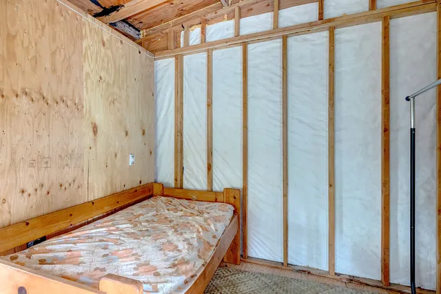 a bathroom with a toilet sink and a large mirror