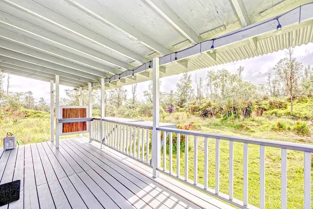 a view of balcony with wooden floor