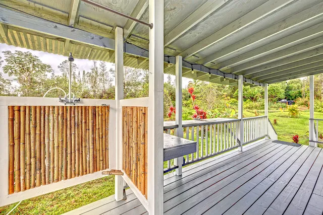a view of a glass door with a tree