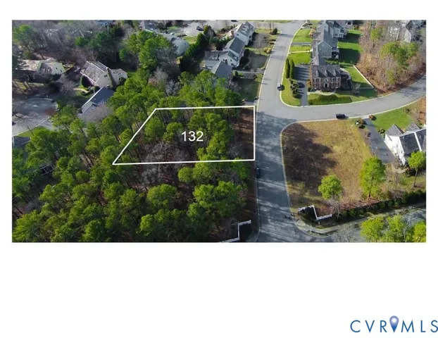 an aerial view of a house with a garden