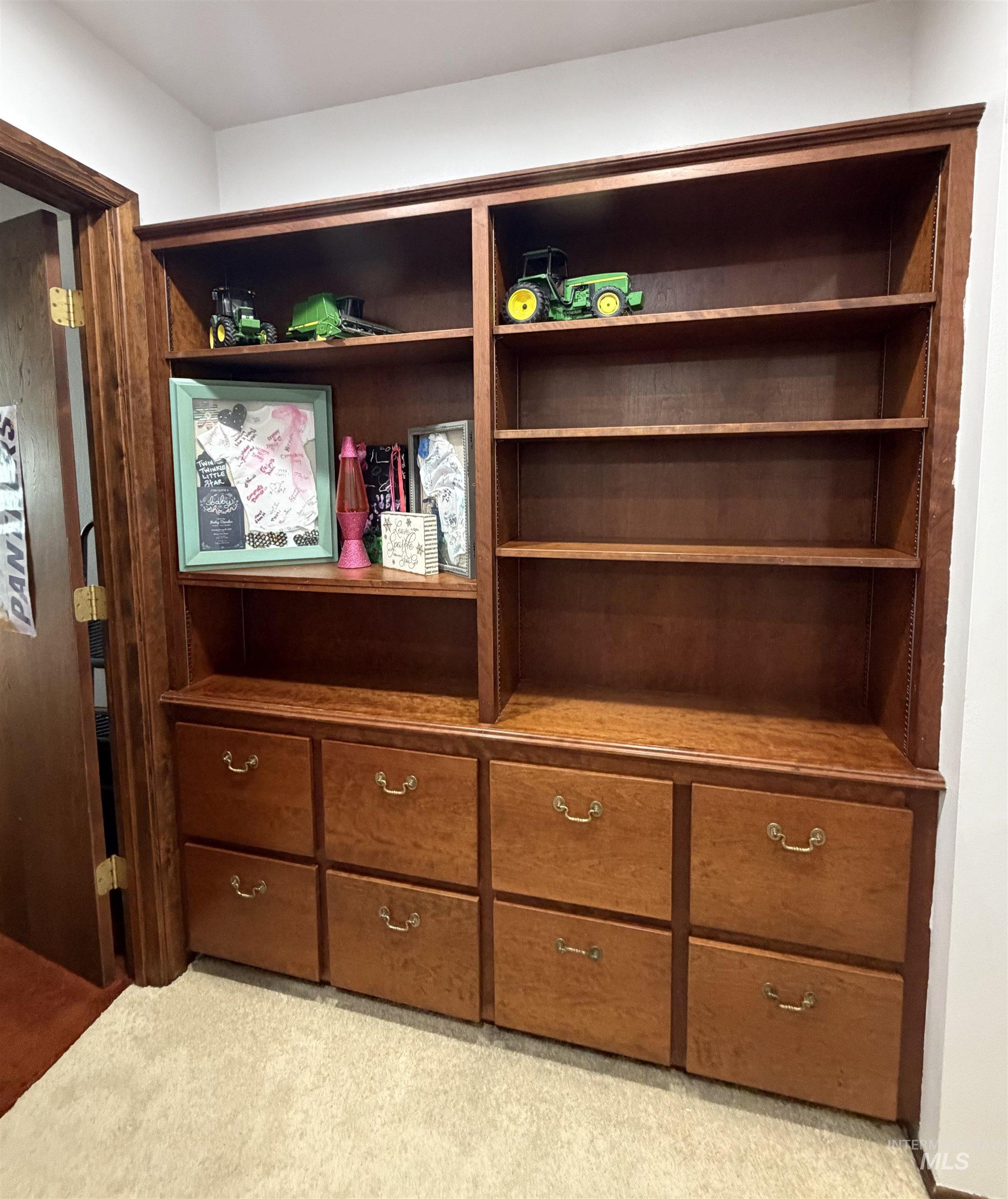 880 Jenkins Creek Road Weiser, ID 83672 - Photo 33 of 43 Built-in wood cabinetry featuring multiple shelving units and integrated lower drawers with brass-finish hardware