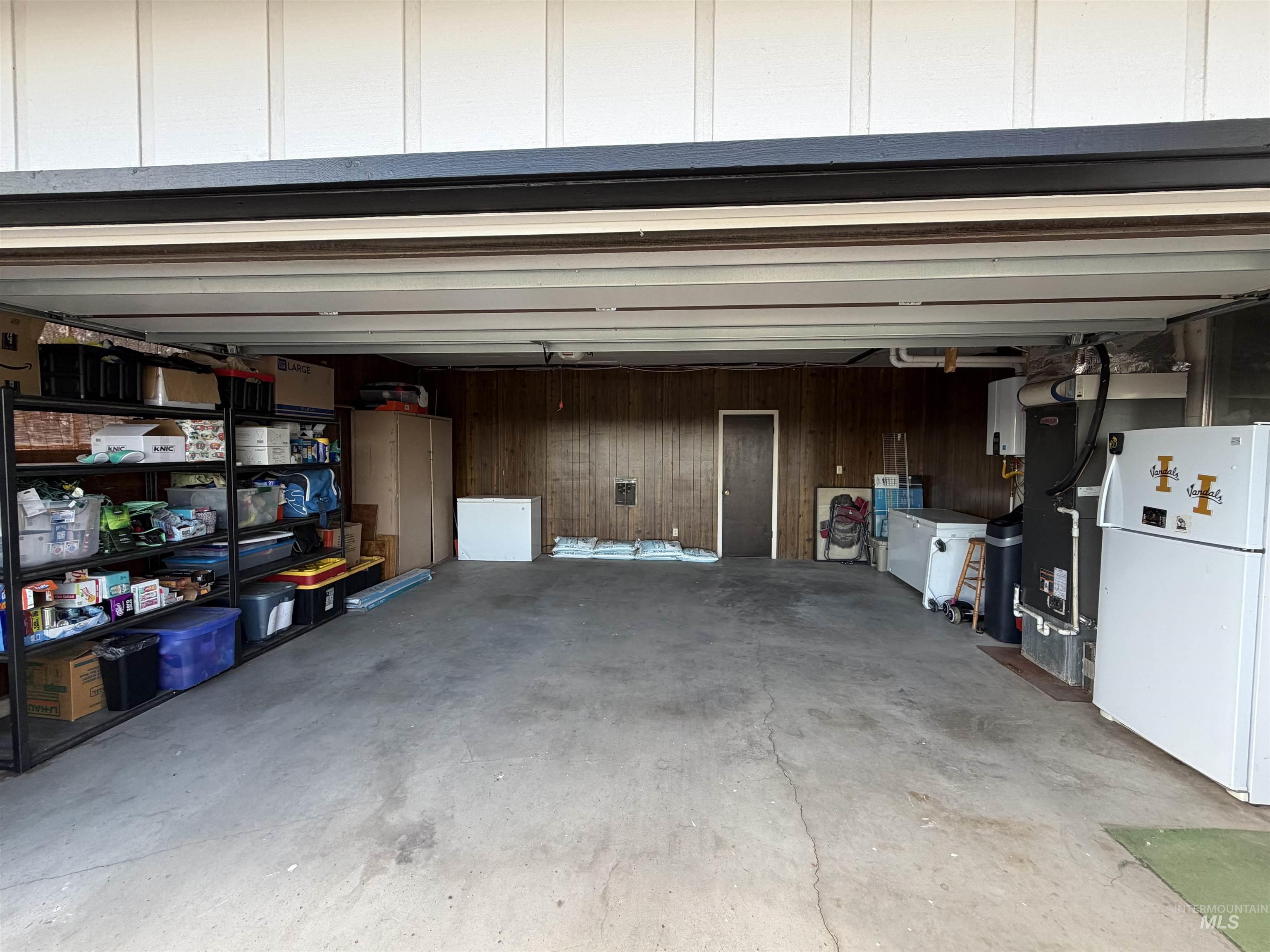880 Jenkins Creek Road Weiser, ID 83672 - Photo 35 of 43 Spacious garage with concrete flooring and wood paneling