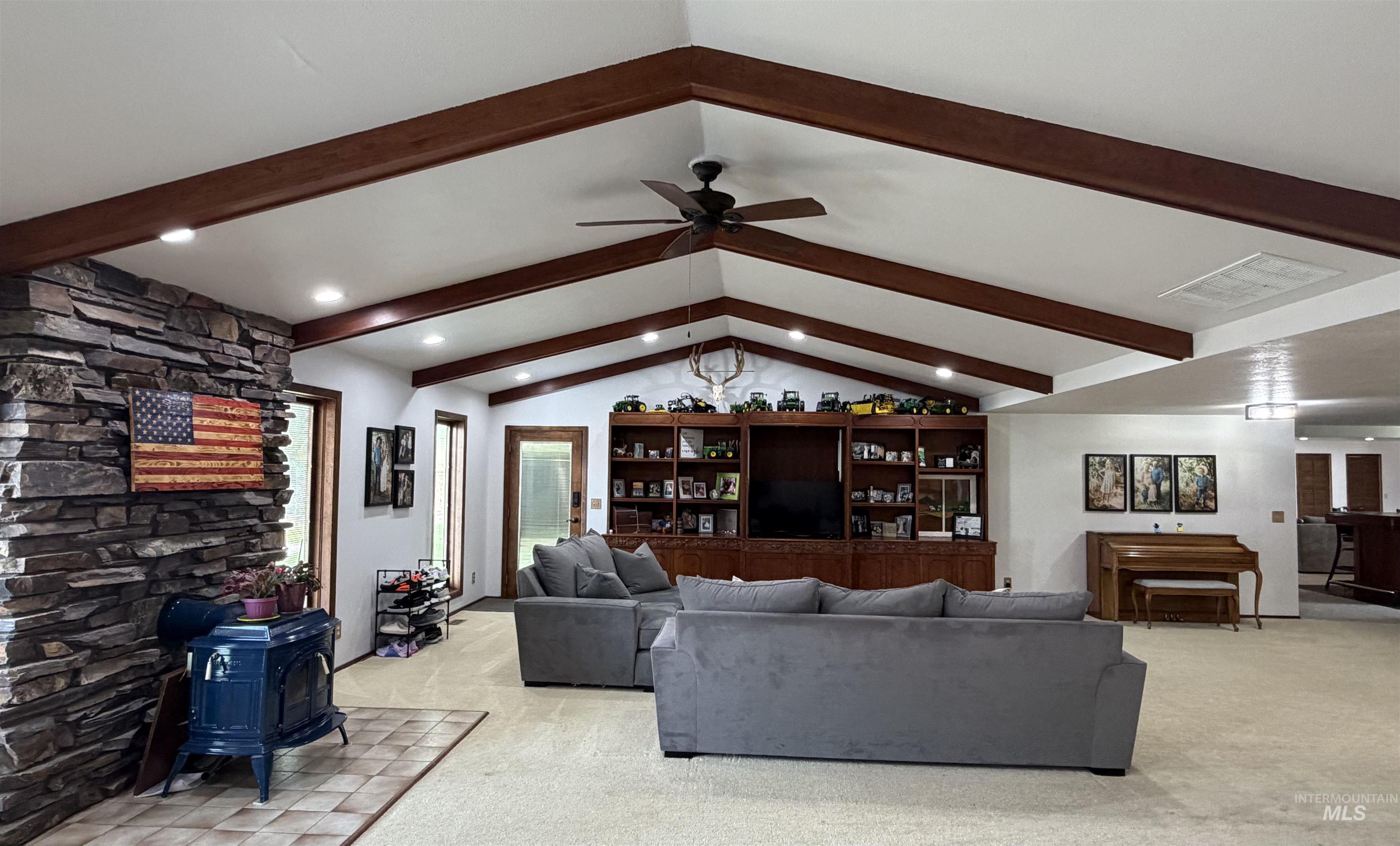 880 Jenkins Creek Road Weiser, ID 83672 - Photo 8 of 43 Living area featuring a vaulted ceiling with exposed wood beams, recessed lighting, and a ceiling fan