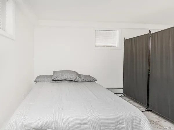 a bedroom with a bed and a cabinets