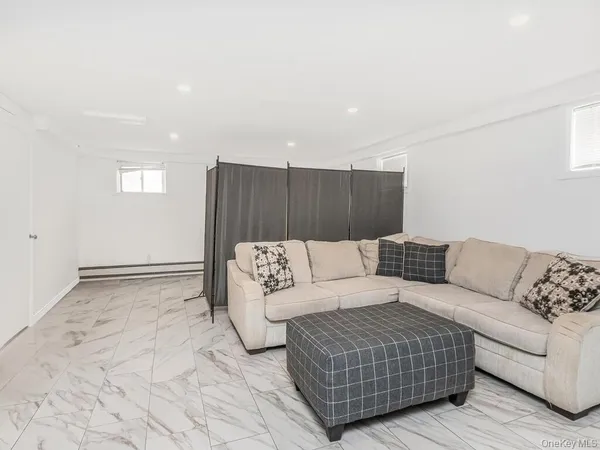 a living room with furniture and a rug