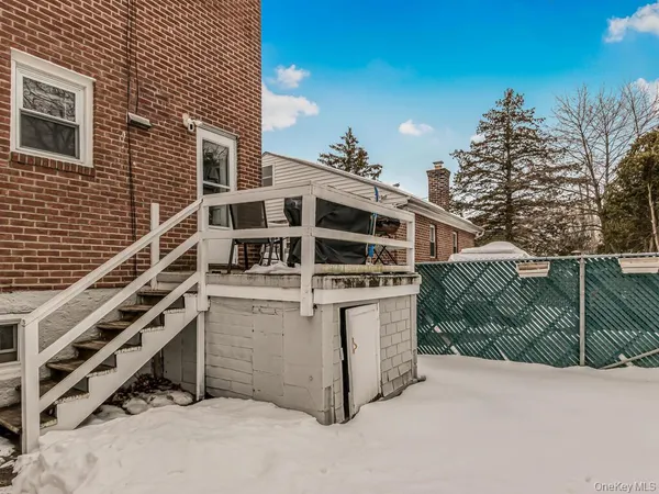 a view of a house with a small yard