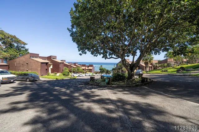 a view of a street with a building in the background