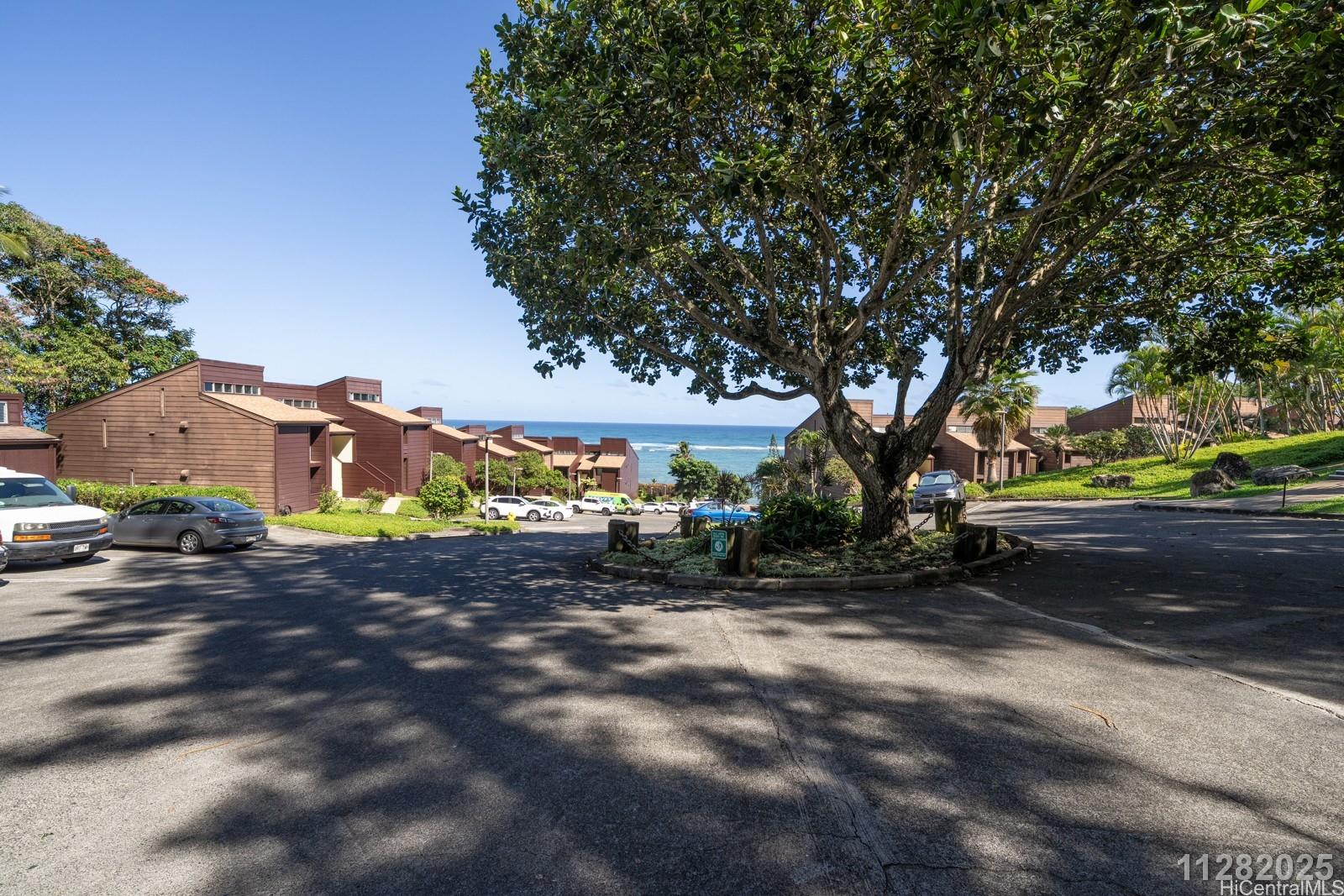 a view of a street with a building in the background