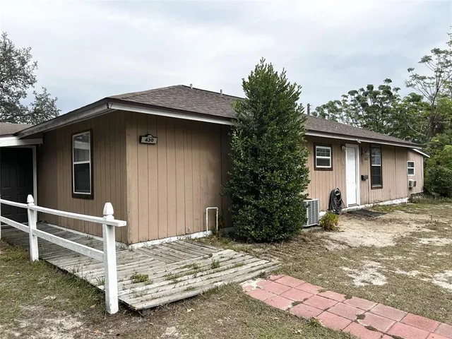 a house with trees in the background