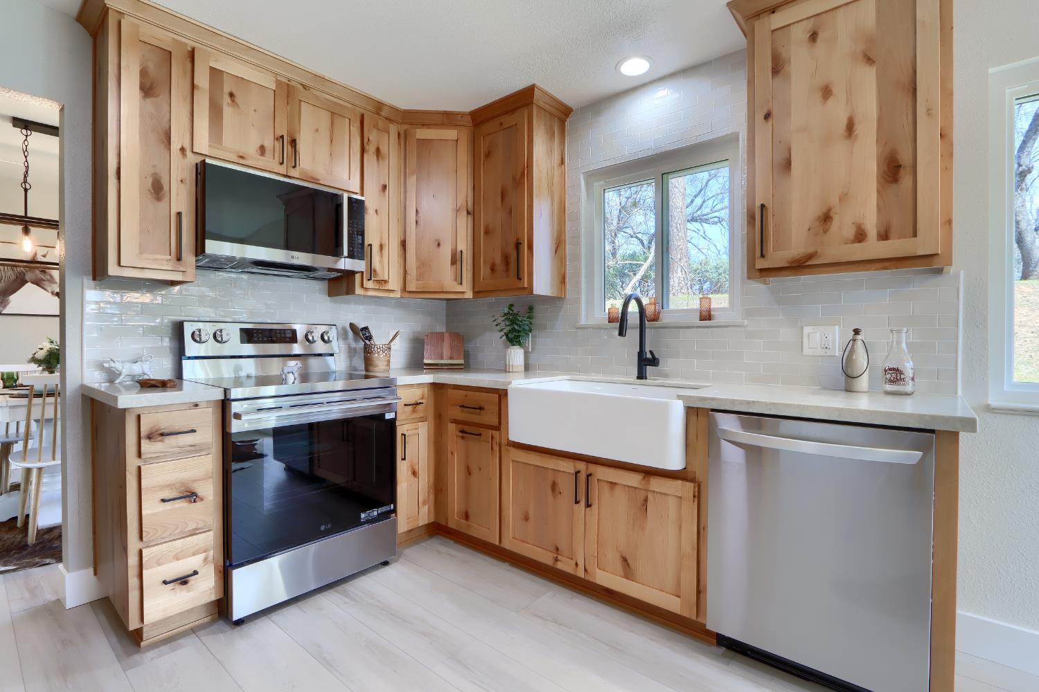 5518 East Whitlock Road Mariposa, CA 95338 - Photo 16 of 57 a kitchen with stainless steel appliances a stove microwave and sink