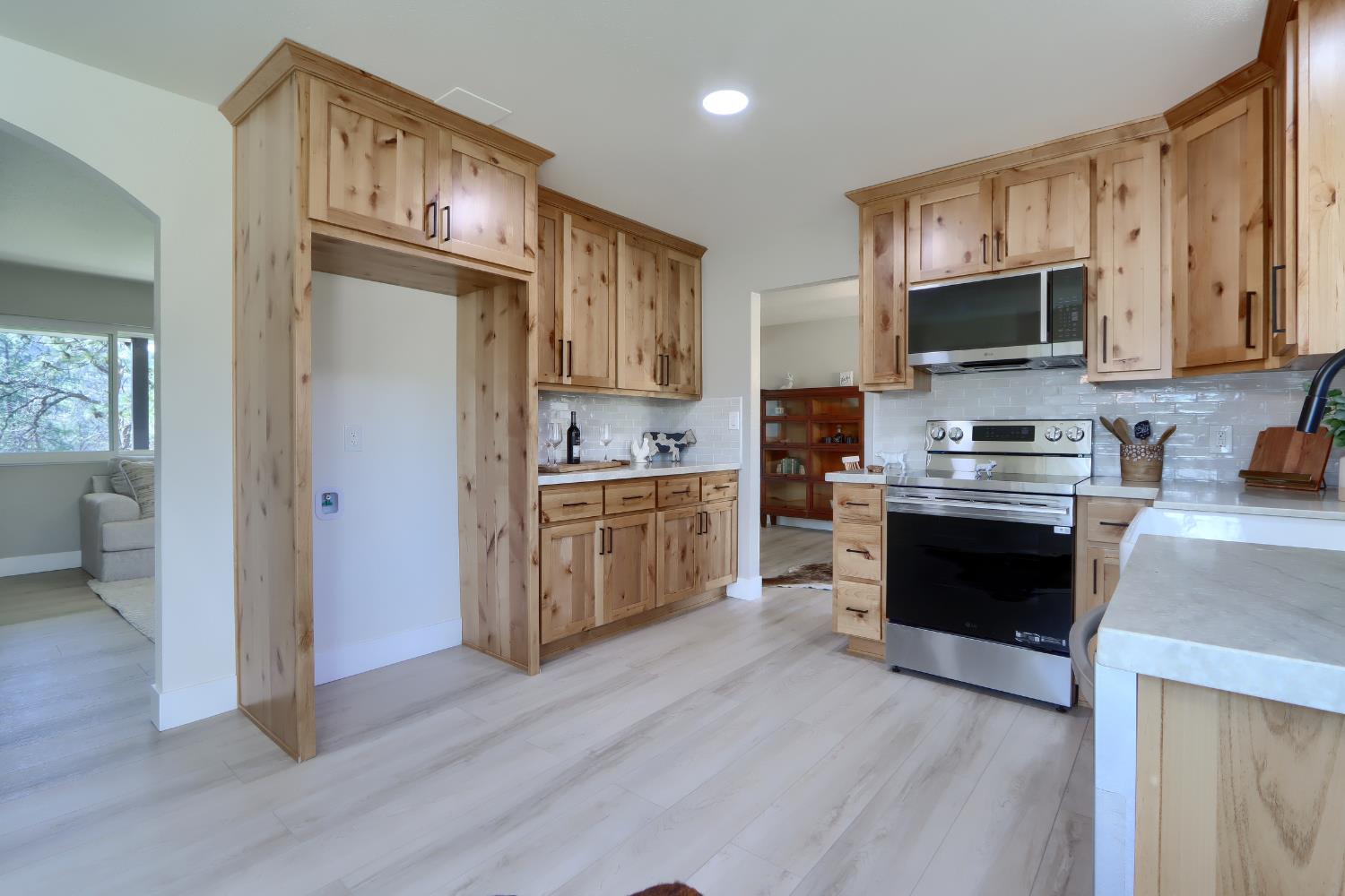 5518 East Whitlock Road Mariposa, CA 95338 - Photo 17 of 57 a kitchen with stainless steel appliances a refrigerator sink and microwave