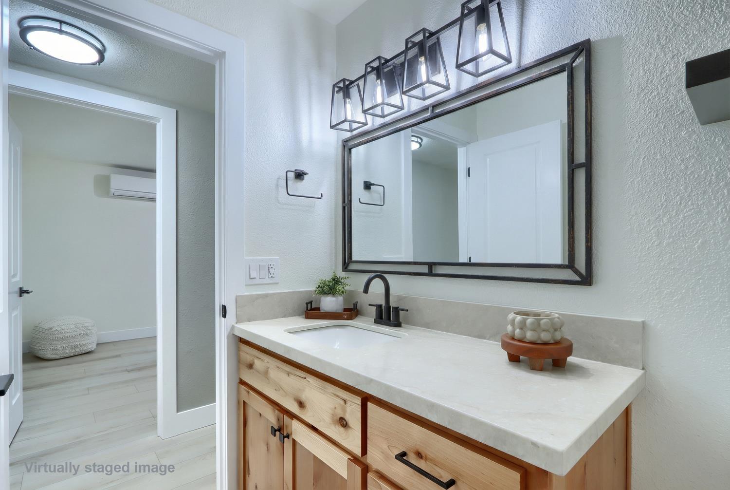 5518 East Whitlock Road Mariposa, CA 95338 - Photo 22 of 57 a bathroom with a sink a toilet and a mirror