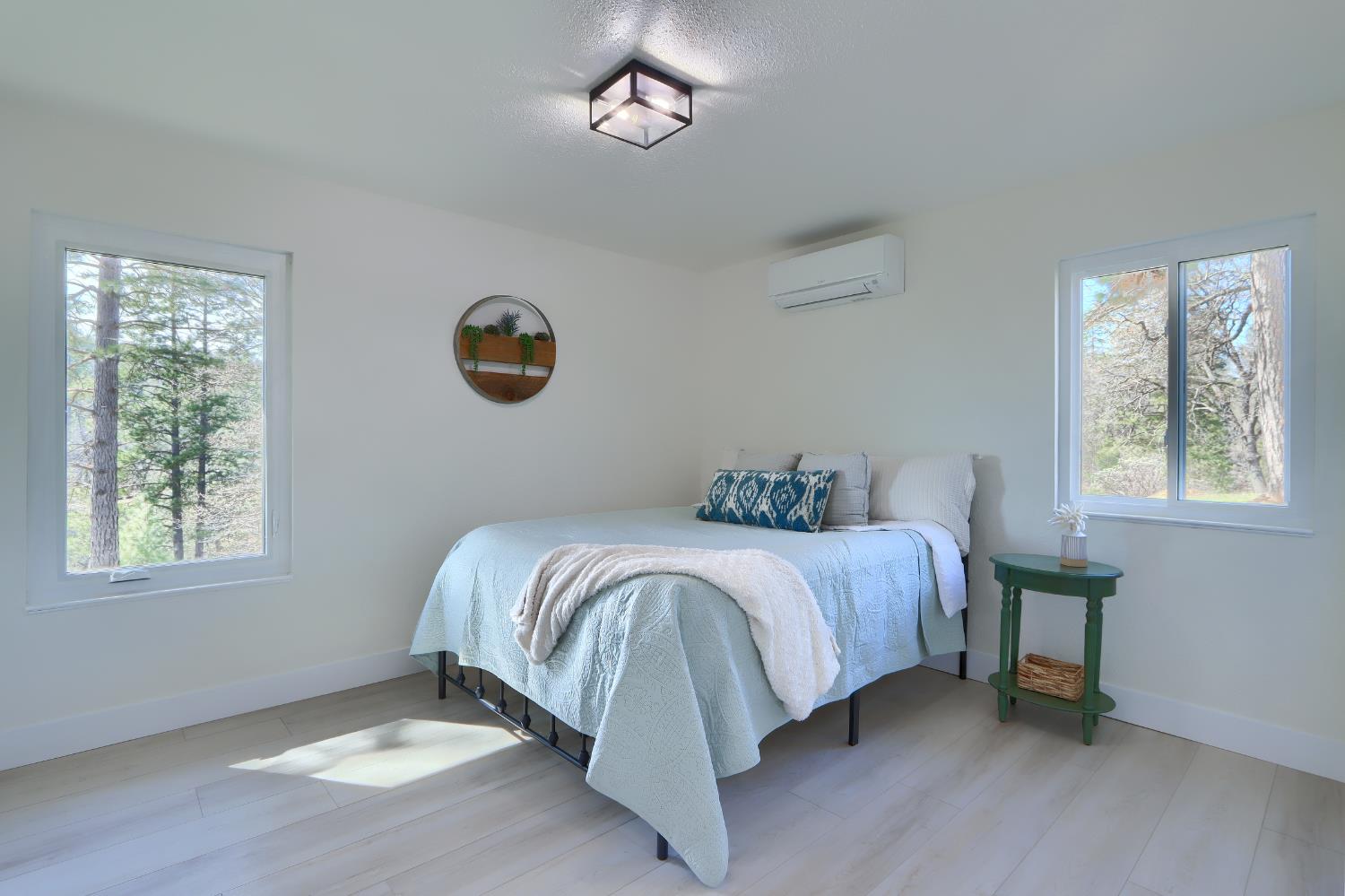 5518 East Whitlock Road Mariposa, CA 95338 - Photo 26 of 57 a bed sitting in a bedroom next to a window