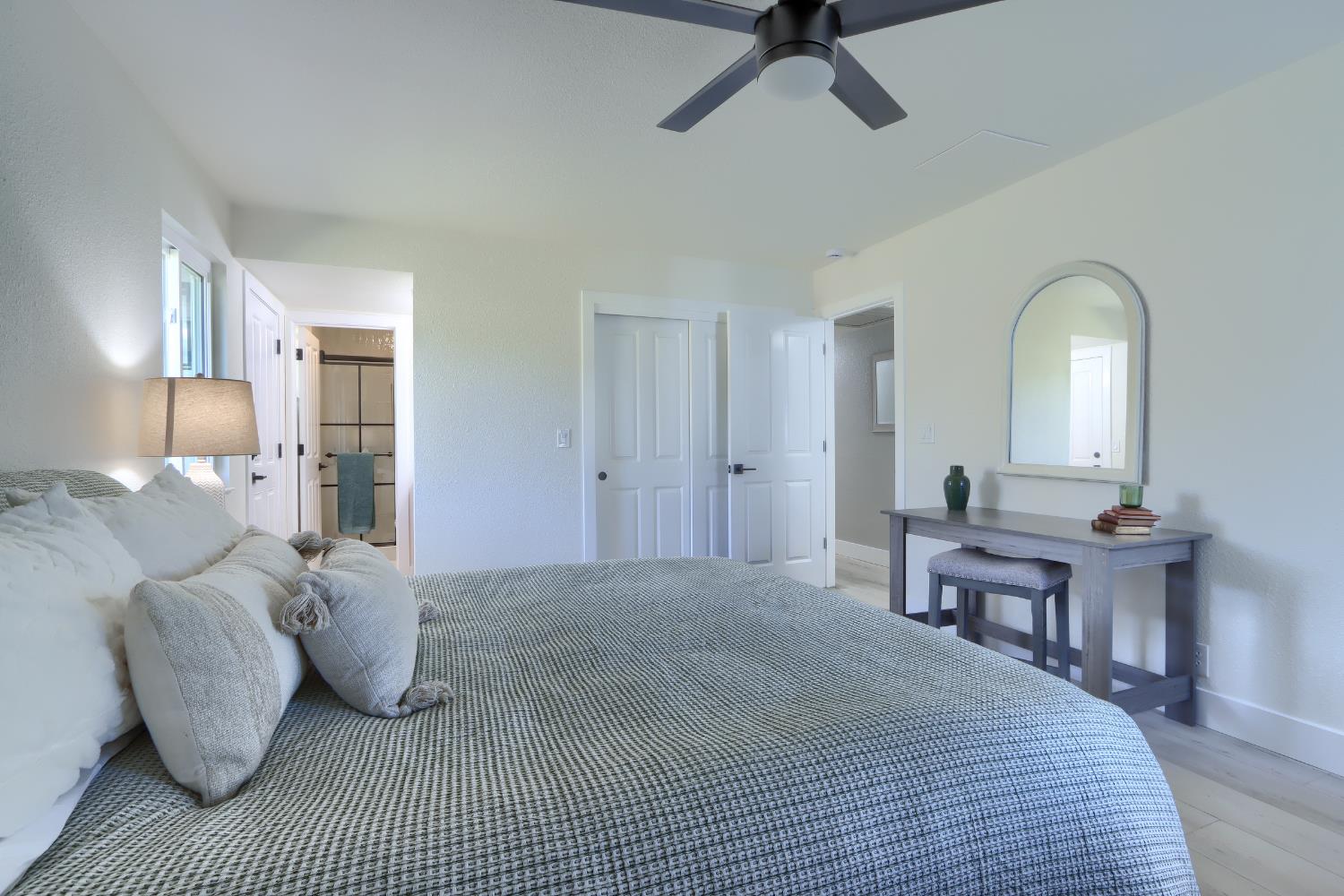 5518 East Whitlock Road Mariposa, CA 95338 - Photo 30 of 57 a bedroom with a bed and wooden floor