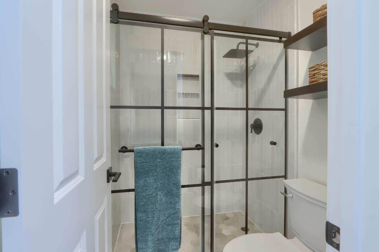 5518 East Whitlock Road Mariposa, CA 95338 - Photo 32 of 57 a bathroom with a shower and toilet