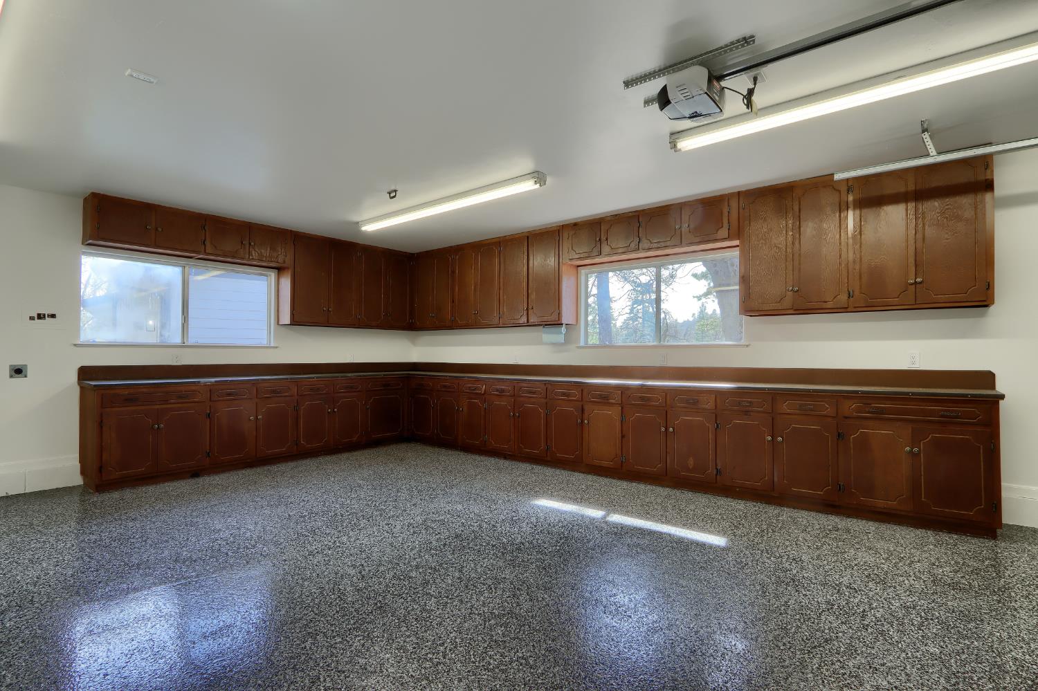 5518 East Whitlock Road Mariposa, CA 95338 - Photo 38 of 57 a kitchen with stainless steel appliances kitchen island granite countertop a sink window and cabinets
