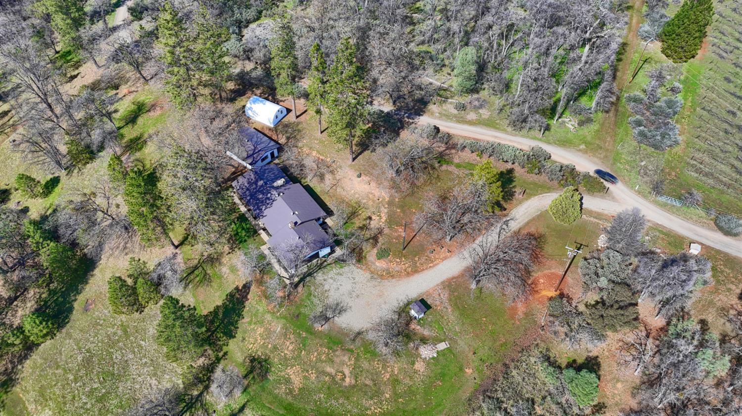 5518 East Whitlock Road Mariposa, CA 95338 - Photo 51 of 57 a view of a lake with a building