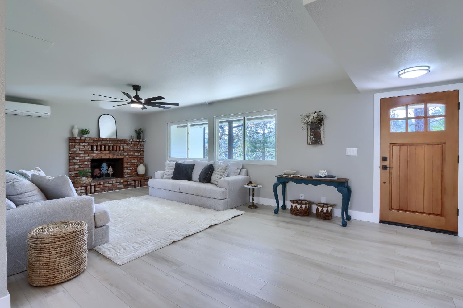 5518 East Whitlock Road Mariposa, CA 95338 - Photo 7 of 57 a living room with furniture a fireplace and a window