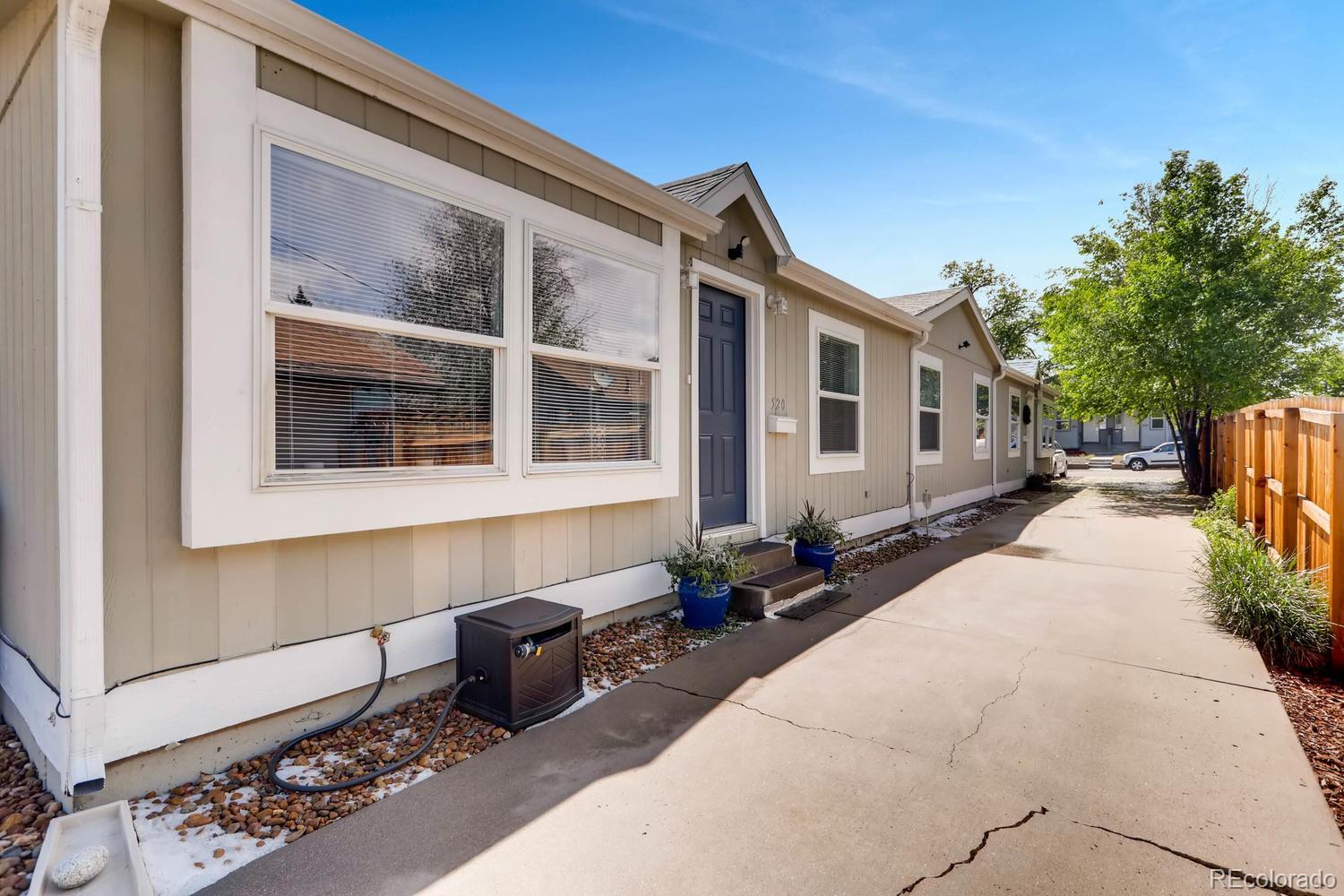 520 South Raleigh Street Denver, CO 80219 - Photo 3 of 27 a front view of a house with windows