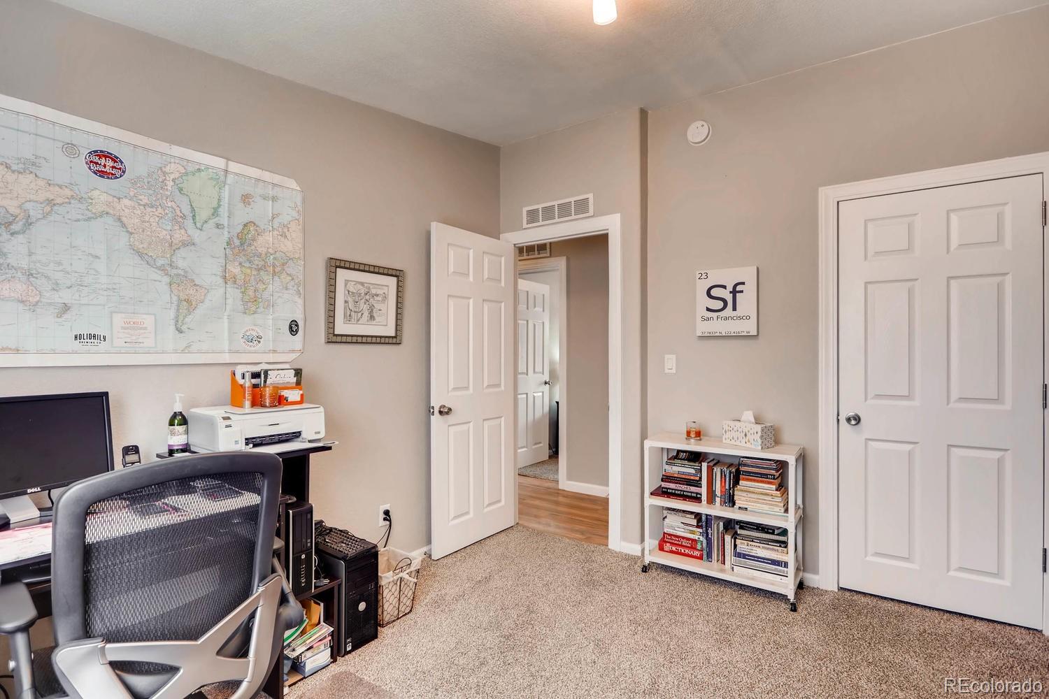 520 South Raleigh Street Denver, CO 80219 - Photo 10 of 27 a view of a livingroom with fridge and workspace
