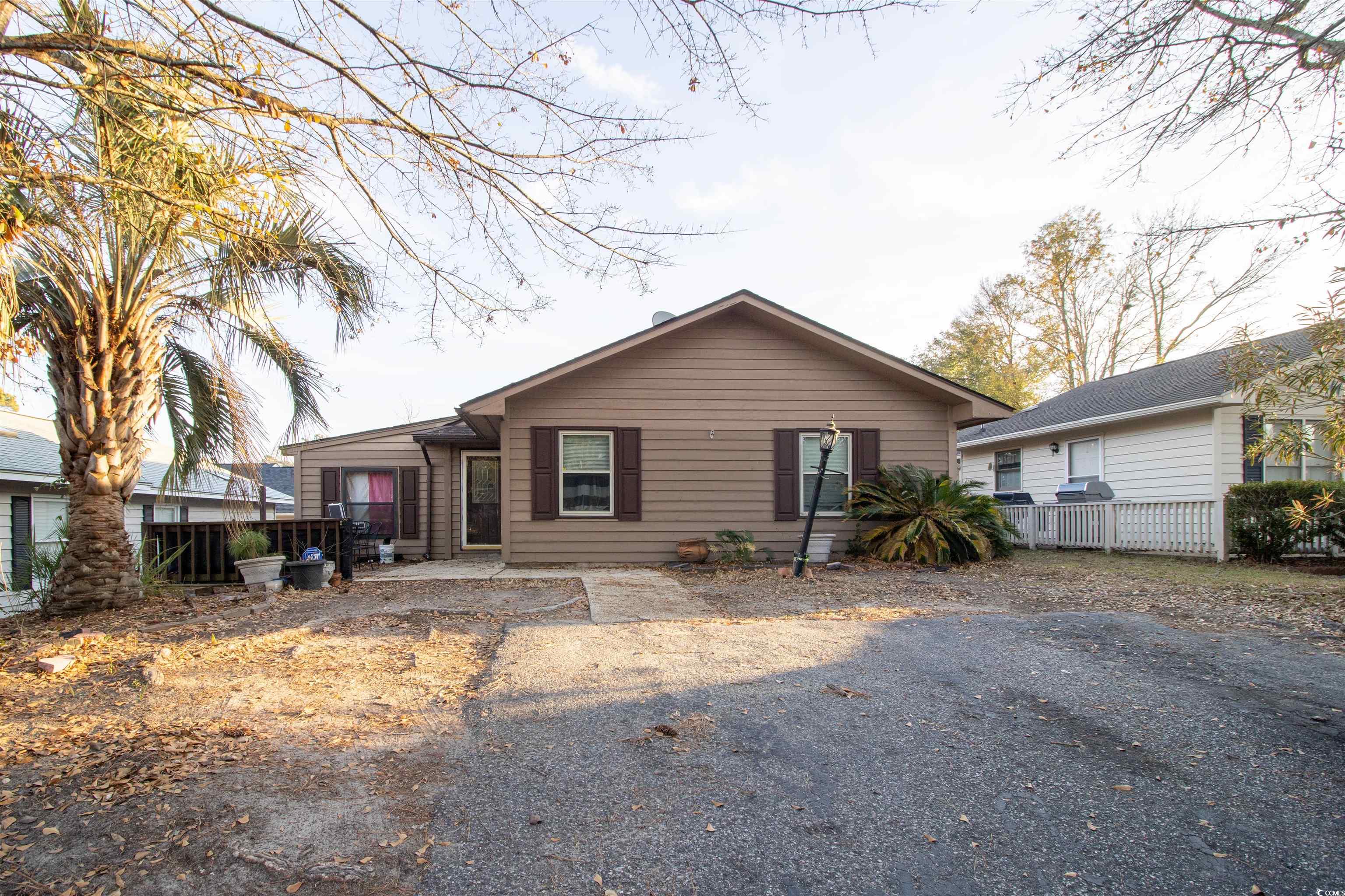 Back of property with a patio