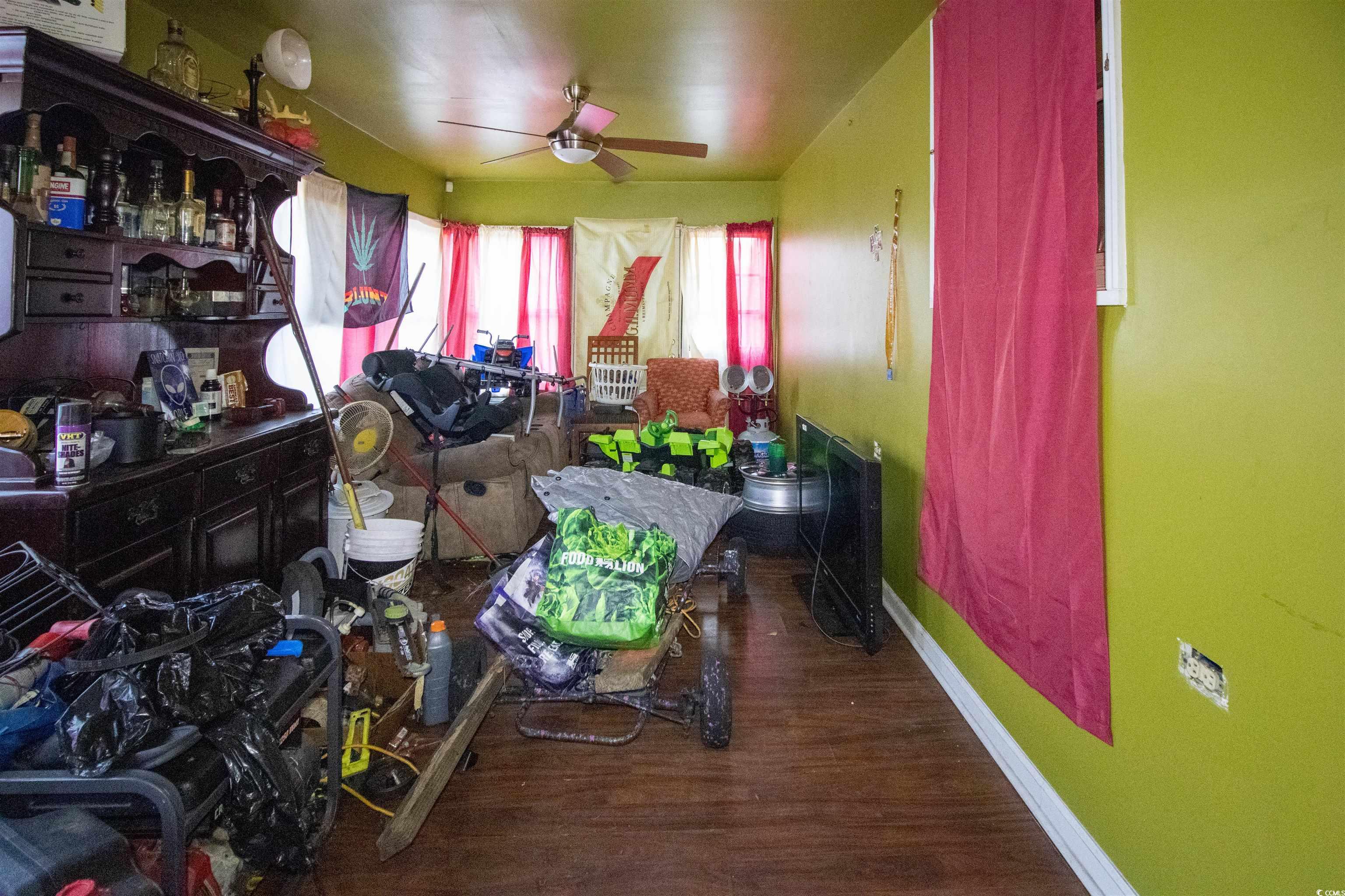 41 Channing Drive Little River, SC 29566 - Photo 13 of 19 Dining space featuring dark wood-style floors and a ceiling fan