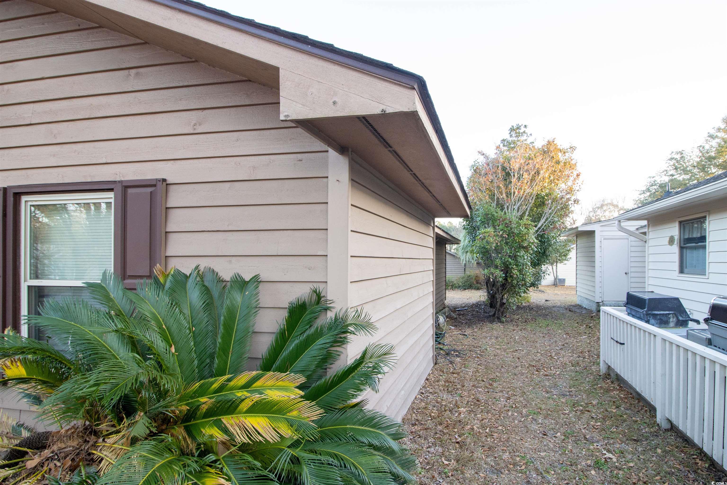 41 Channing Drive Little River, SC 29566 - Photo 16 of 19 View of side of property