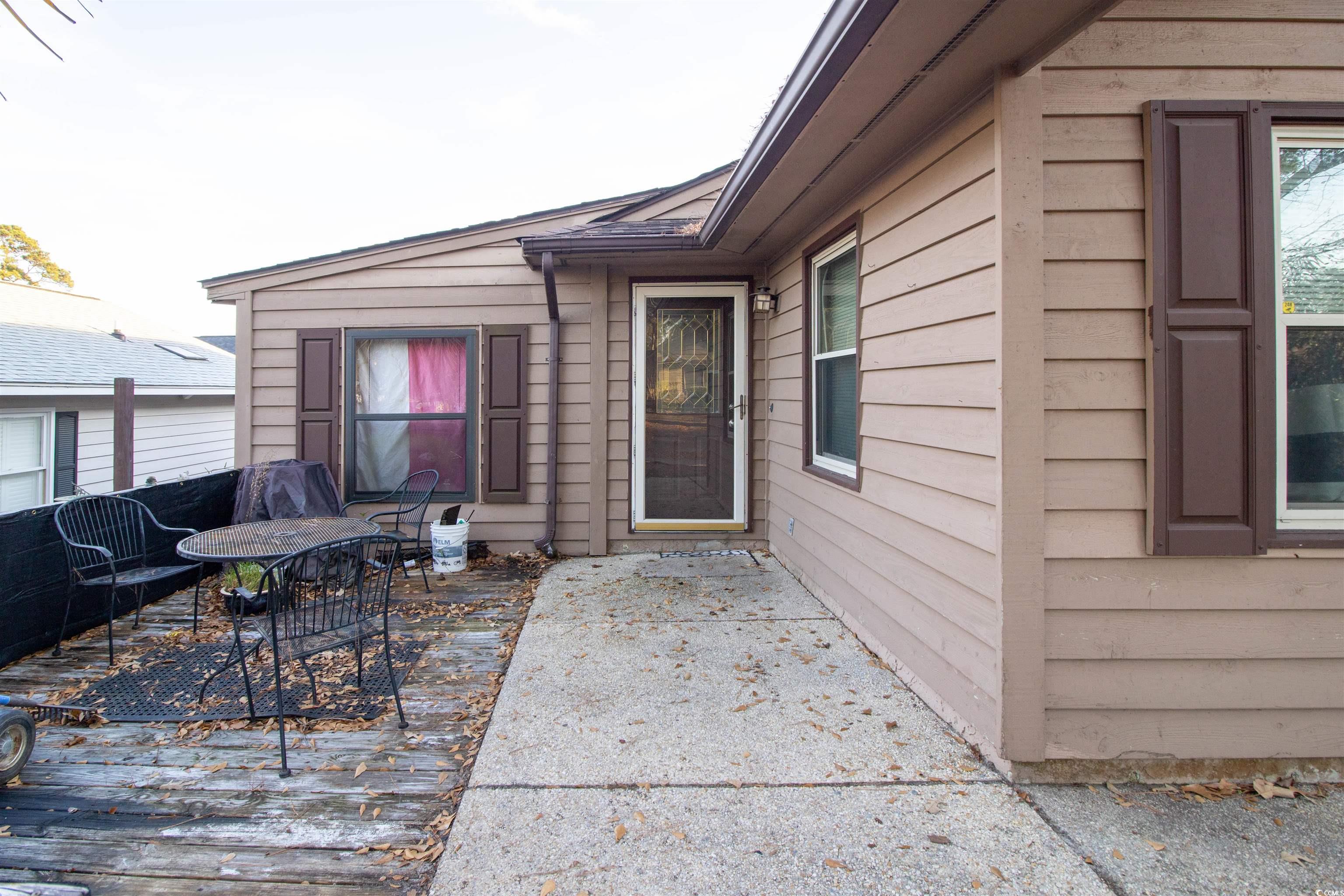 41 Channing Drive Little River, SC 29566 - Photo 2 of 19 View of patio featuring outdoor dining area
