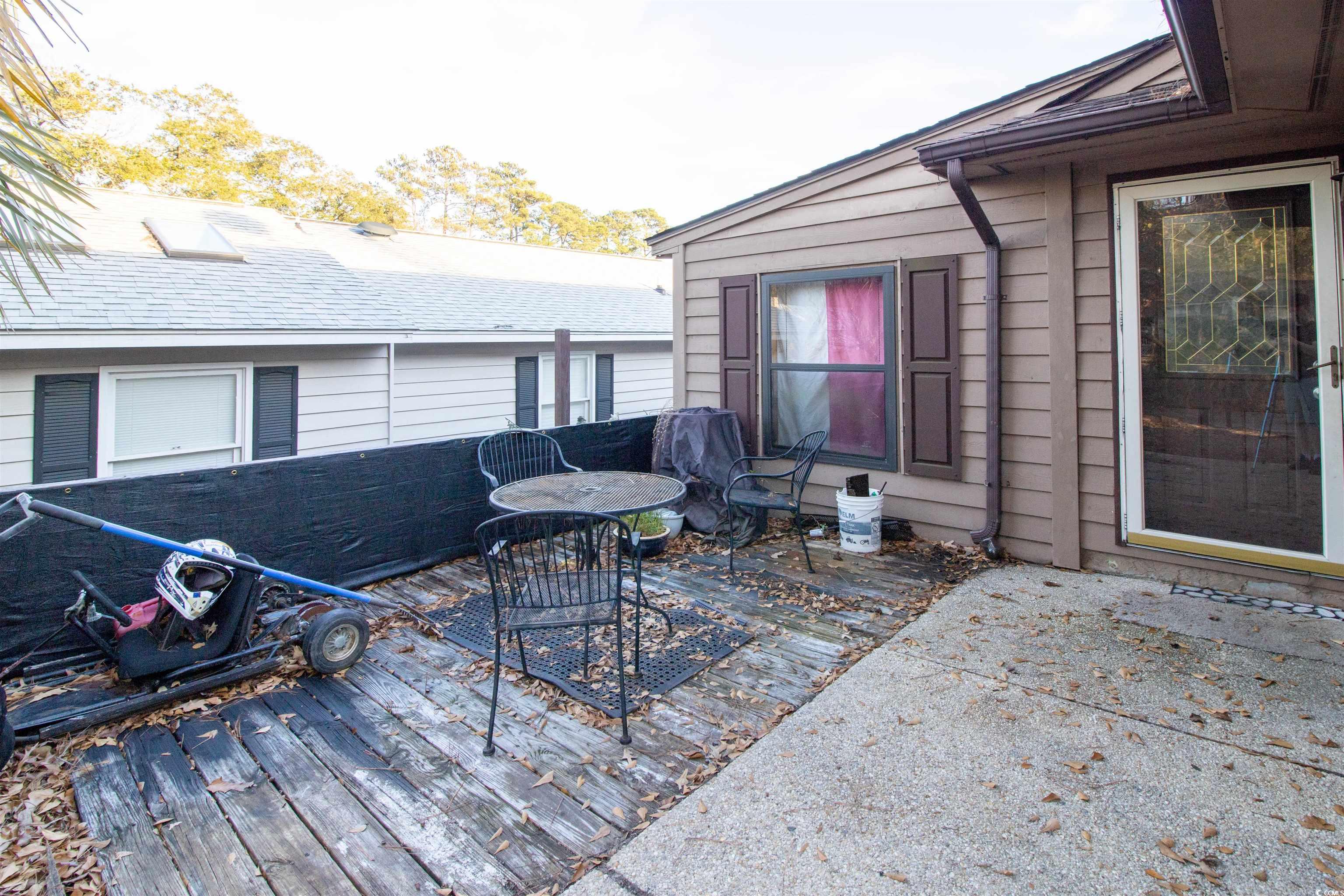 41 Channing Drive Little River, SC 29566 - Photo 3 of 19 Deck with a patio area and outdoor dining space