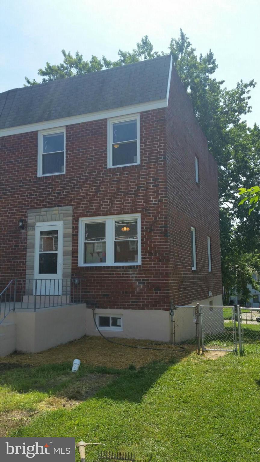 4845 Greencrest Road Baltimore, MD 21206 - Photo 1 of 28 a backyard of a house with lots of green space and fountain