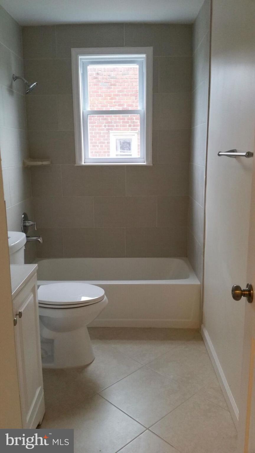 4845 Greencrest Road Baltimore, MD 21206 - Photo 14 of 28 a bathroom with a toilet a sink and a bathtub
