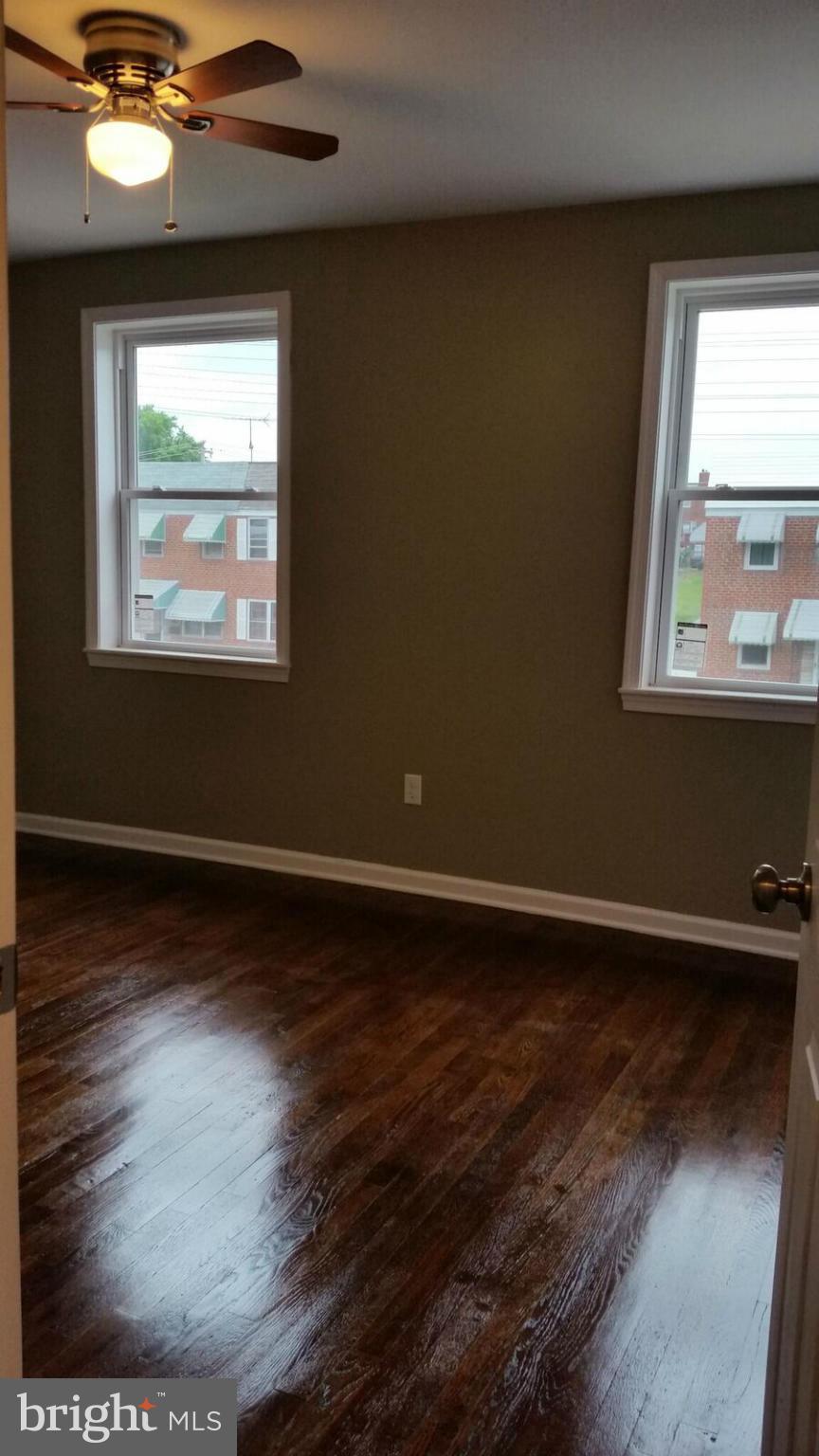 4845 Greencrest Road Baltimore, MD 21206 - Photo 18 of 28 a view of room window and wooden floor