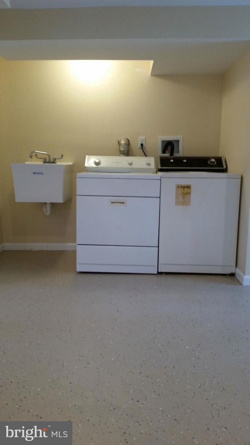 4845 Greencrest Road Baltimore, MD 21206 - Photo 24 of 28 a utility room with dryer and washer