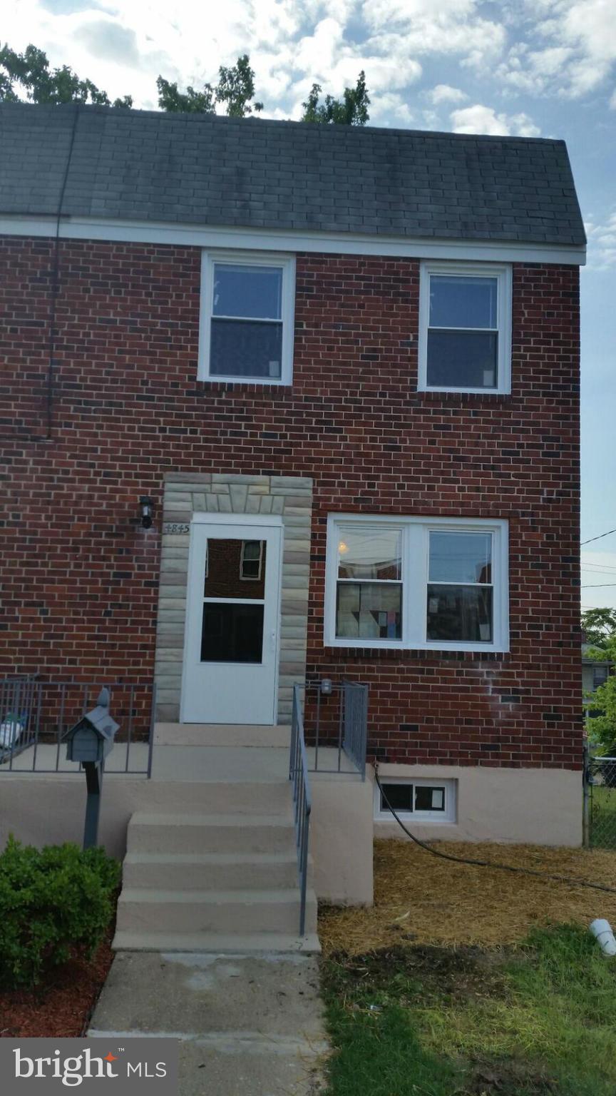4845 Greencrest Road Baltimore, MD 21206 - Photo 25 of 28 a front view of a house with a yard